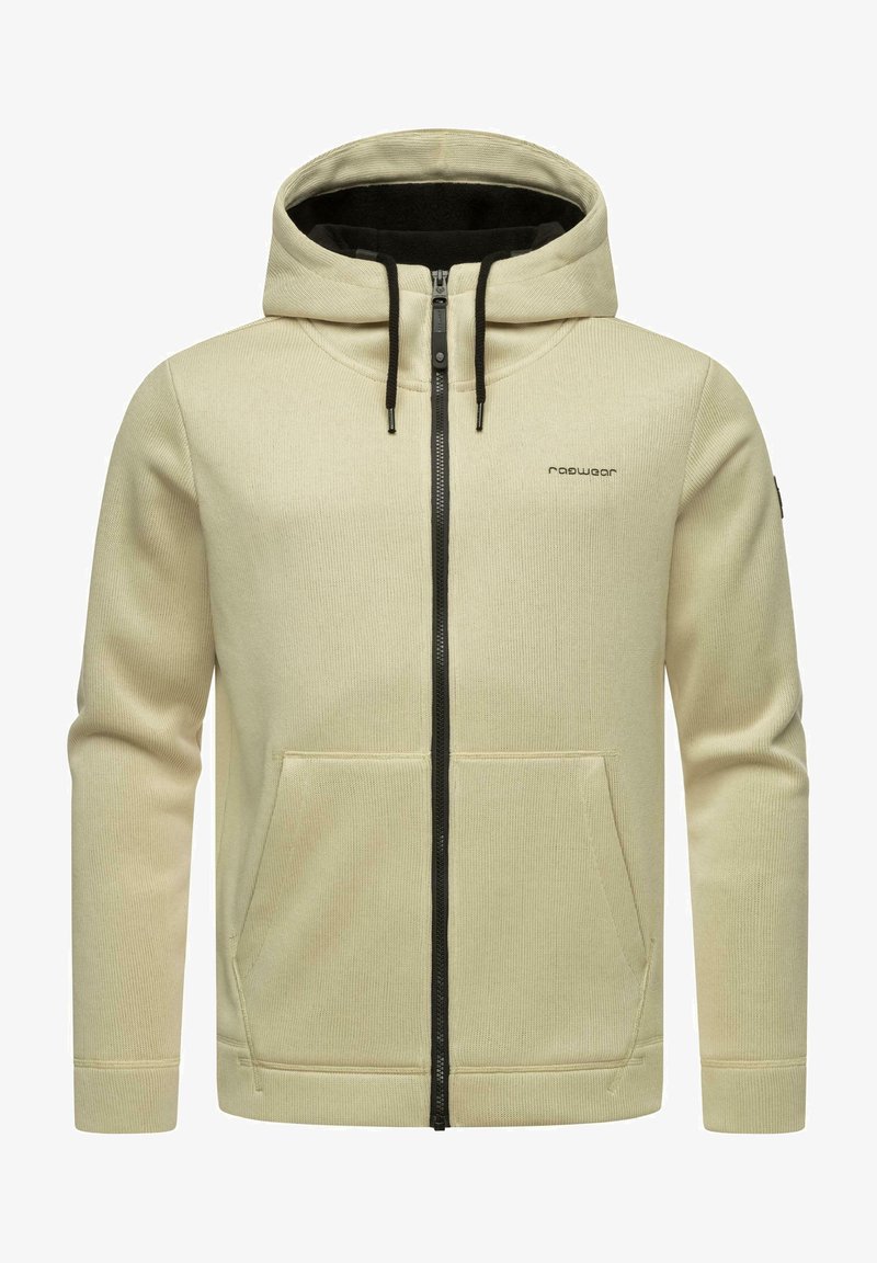 Krēmas krāsas zip-up kapuce ar melnu rāvējslēdzēju, priekšējiem kabatām, biezu audumu, regulējamu kapuci un diskrētu logo kreisajā krūtī.