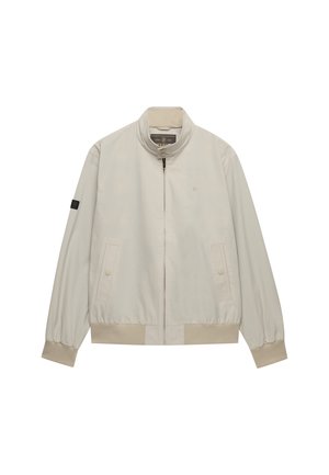 Veste beige clair zippée avec col montant, poignets et ourlet côtelés, poches avant à boutons-pression, et petit logo sur la poitrine et la manche.
