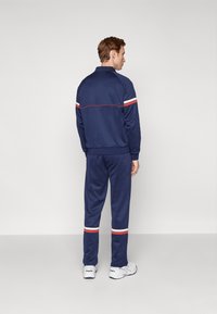 Sergio Tacchini ORION PANTS - Tepláky - navy/red ochre