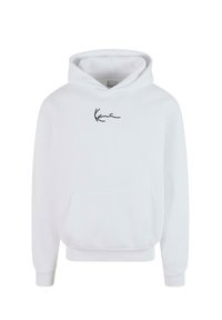 Sweat à capuche blanc en coton. Il dispose d'une poche kangourou à l'avant et d'un logo manuscrit noir sur la poitrine. Tissu doux et texturé avec des poignets côtelés.