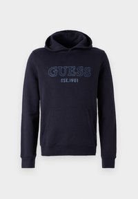 Felpa blu navy realizzata in tessuto morbido, presenta una tasca a marsupio, polsini a costine e il logo ricamato "GUESS EST.1981" sul davanti.