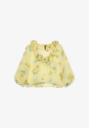 Blusa gialla trasparente con maniche lunghe a sbuffo, stampa floreale, scollo arricciato e dettaglio con fiocco sul petto.
