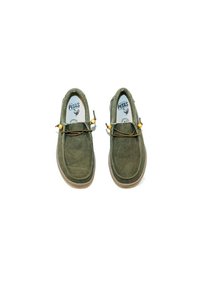 Green suede shoes with a rounded toe, brown rubber sole, and decorative laces. Features yellow accents and a branded insole.