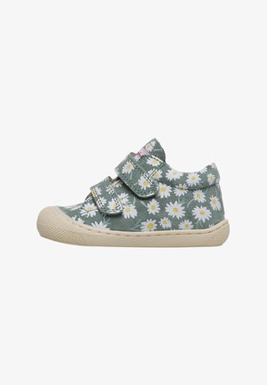 Grønne lærreds sneakers med hvidt tusindfryd-mønster, to velcro-stropper, rund tå og tekstureret gummisål.