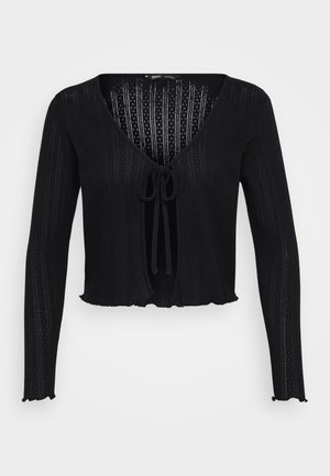 Črni kratki kardigan iz ribane tkanine, z dolgimi rokavi, globokim V-izrezom in zavezovanjem spredaj ter valovitim robom.