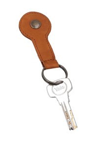 Silver Yale key attached to a round brown leather keychain with metal button and ring on a white background.