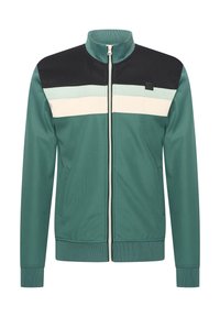 Giacca zip verde con colletto rialzato, pannello nero sulle spalle e righe bianche sul petto. Realizzata in tessuto testurizzato e dotata di due tasche.