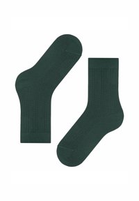 Chaussettes vert foncé avec un motif texturé, dotées d'accents côtelés et d'une longueur mi-mollet. Fabriquées à partir d'un matériau tissé doux.
