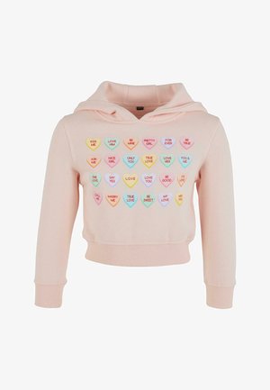 Sudadera corta de color rosa con una textura suave, que presenta gráficos de corazones en tonos pastel con diversas frases bordadas en el frente.