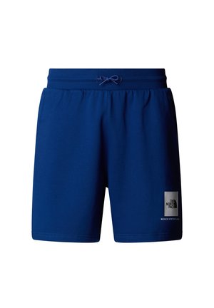 Pantalones cortos de algodón azul con cintura elástica y cordón. Cuenta con un parche de logo en la pierna izquierda. Textura suave, diseño hasta la rodilla.