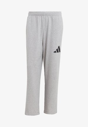 Sive trenirke od mješavine pamuka. Imaju elastičnu traku u struku i crni adidas logo dizajn na lijevom bedru. Ravan kroj nogavica.