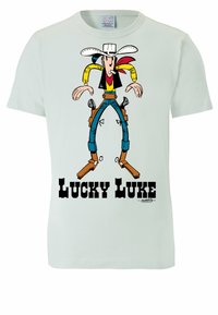 Light green cotton t-shirt featuring a cartoon cowboy character in yellow, black, and red, with "LUCKY LUKE" printed below in bold black text.