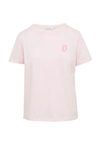 Rosa Baumwoll-T-Shirt mit rundem Halsausschnitt und kurzen Ärmeln. Verfügt über einen kleinen „CI“-Druck in einem etwas dunkleren Rosa im linken Brustbereich.