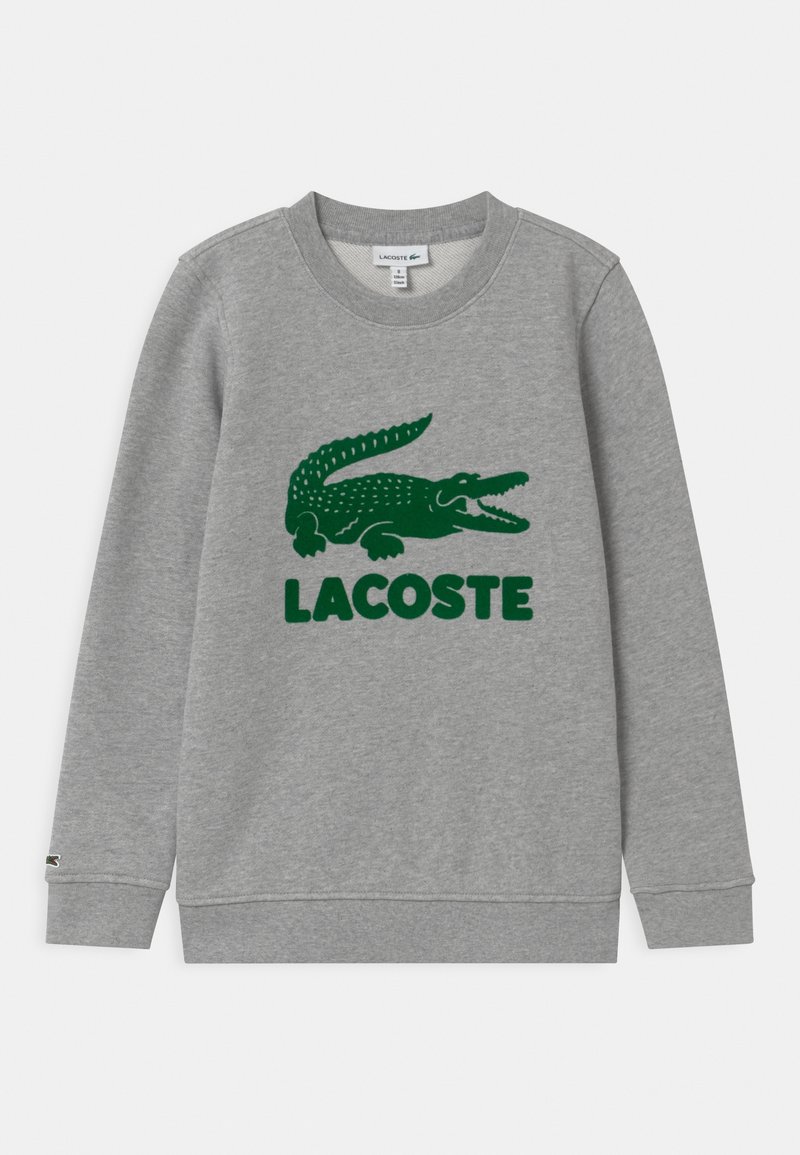 Szara bluza wykonana z mieszanki bawełny, z zielonym logo krokodyla i napisem "LACOSTE". Mankiety i dół bluzy wykończone ściągaczem, okrągły dekolt.