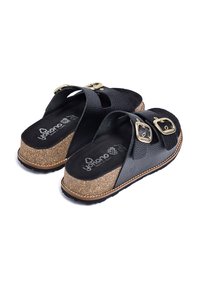 Schwarze Kunstleder-Sandalen mit zwei verstellbaren goldenen Schnallen, Kork-Mittelsohle und strukturiertem schwarzen Fußbett. Gummisohle für guten Halt.