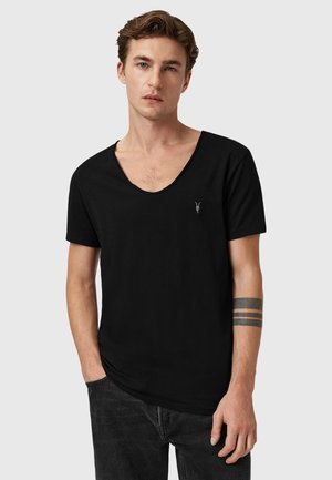 Black cotton t-shirt with a deep V-neck design and short sleeves. Features a small logo on the chest. Smooth texture, casual fit.