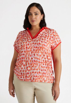CON STAMPA A FIORI - Polo shirt - arancione