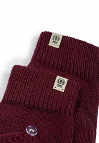 Burgundy knit gloves with ribbed texture, featuring a rectangular tag and a clear button detail on the wrist cuff.