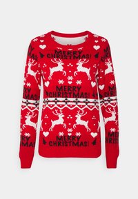 Pull de Noël rouge avec des motifs de rennes blancs, de flocons de neige, de cœurs, de houx et le texte « Joyeux Noël ! ».