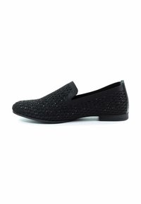 Scarpe nere slip-on con upper in mesh testurizzato e un leggero luccichio, tacco basso e suola in gomma nera liscia.
