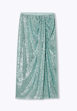 Jupe midi en sequins vert menthe avec un design drapé. Caractéristiques d'une surface texturée avec des sequins argentés brillants et une taille lisse.