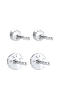 Boucles d'oreilles en argent avec un dessus lisse et arrondi et un dos circulaire, marquées 925 pour argent sterling, avec des tiges droites pour le maintien.
