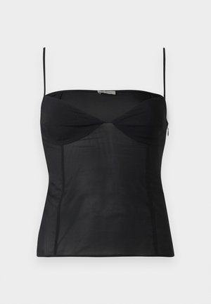 Haut noir ajusté sans manches avec fines bretelles, encolure en cœur et détails de coutures sur un fond blanc uni.