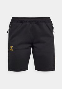 Shorts de sport noirs avec taille élastique, poches latérales zippées et logo Hummel jaune sur la jambe gauche.