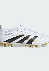 White soccer cleat with black and gold accents, textured upper, lace closure, and multiple studs on a cream outsole. Features "Predator" branding.