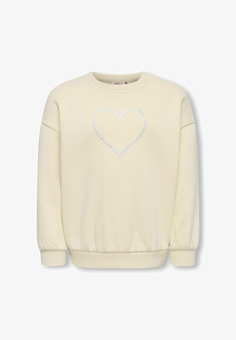 Felpa color crema con scollo rotondo e maniche arricciate, con un design a forma di cuore realizzato con piccoli dettagli scintillanti sul davanti.