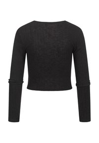 Svart, ribbet, langermet crop top med rund halslinning. Har tettsittende ermer med samlet mansjett. Laget av et teksturert stoff.