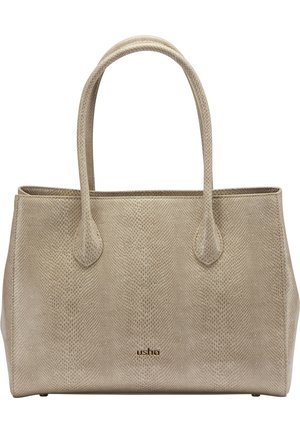 Beige getextureerde totehandtas met lange hengsels en een klein gouden "usha"-logo in het midden aan de voorkant, rechthoekige vorm met zachte zijkanten.