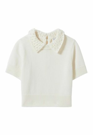 Pull court à manches courtes en crème. Il présente un col tricoté texturé avec des accents de perles. Ourlet côtelé et poignets.