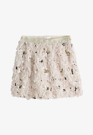 Kort, palietbesat nederdel i sart lyserød med en fluffy tekstur. Den har en elastisk guldbånd i taljen og spredte guld- og sølvpalietter.