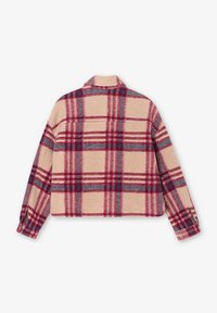 Veste courte à carreaux beige, ornée de motifs en tartan rouge et bleu. Texture douce et poignets boutonnés. Détail de empiècement au dos.