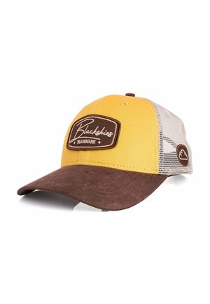 Sárga és barna sapka hálós hátrésszel, ívelt barna karimával, valamint "Blackskies Trademark" felirattal az első panelen.