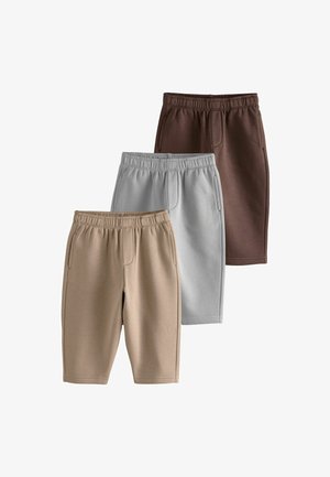 Tre par knælange korte bukser med elastiske taljebånd i beige, lysegrå og mørkebrun, arrangeret overlappende på en hvid baggrund.