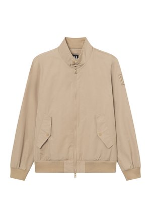 Chaqueta bomber beige con cremallera frontal, cuello con botones a presión, dos bolsillos con solapa inclinados, puños y dobladillo acanalados.
