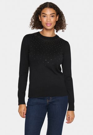 Maglione nero con scollatura rotonda, maniche lunghe e decorato con piccole pietre scintillanti nella parte superiore, orlo e polsini a costine aderenti.