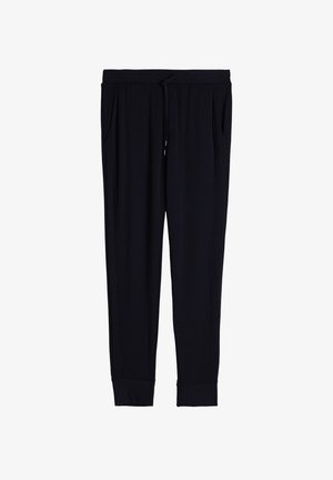 Pantalons de jogging noirs en tissu doux, avec une taille élastique et un cordon de serrage, des poches sur les côtés et des chevilles resserrées.