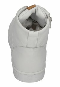 White leather ankle boot with a rounded toe and slightly padded collar. Side zipper closure and a contrasting tan accent on the heel.