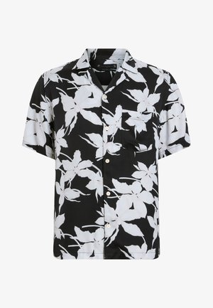 Chemise à manches courtes en tissu noir avec un grand motif floral blanc. Caractérisée par une poche poitrine et une coupe décontractée.