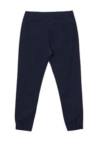 Marineblaue Hose aus glattem Stoff, mit einem elastischen Bund, zwei Gesäßtaschen und schmal zulaufenden Bündchen an den Knöcheln.