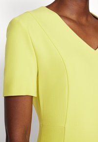 BOSS DAMAISA - Žerzejové šaty - medium yellow
