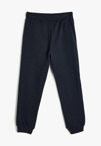 Marineblaue Sweatpants mit einem enganliegenden Bund und Bündchen. Hergestellt aus weichem Stoff, der eine glatte Textur aufweist und keine sichtbaren Muster oder Logos zeigt.