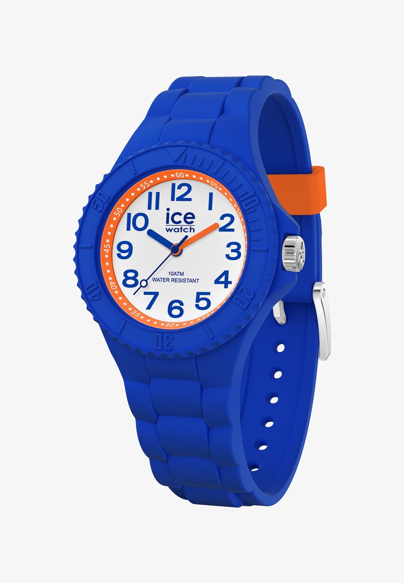 Mėlynas silikono laikrodis su baltu ciferblatu, oranžiniais akcentais, dideliais skaičiais ir tekstūruota juosta. Vandeniui atsparus iki 10 ATM.