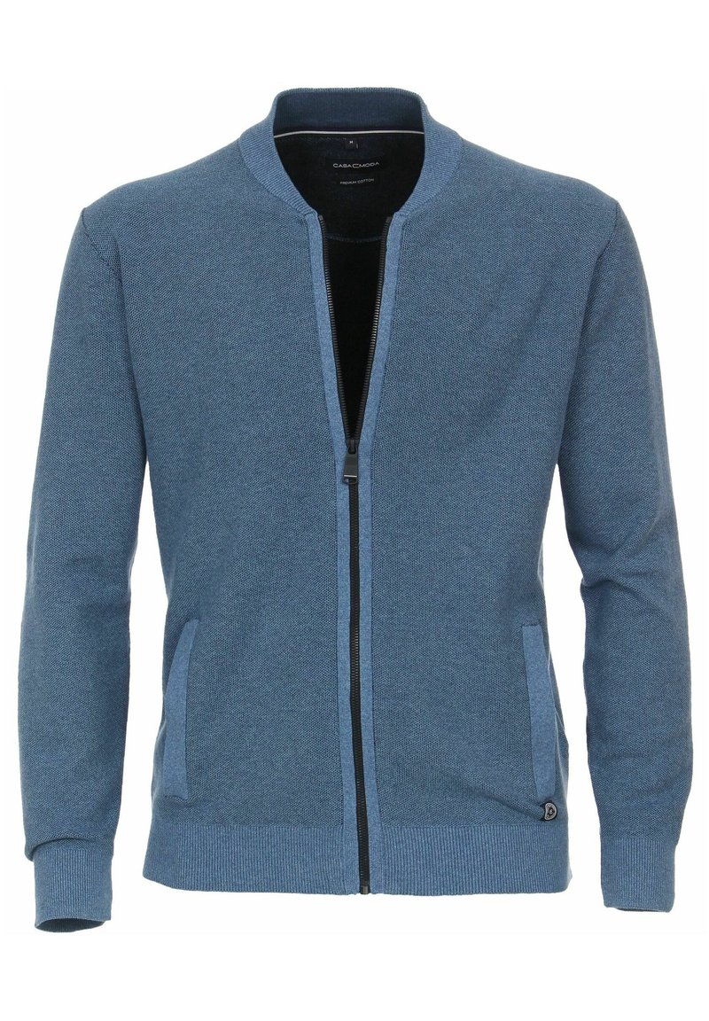 Modrá pletená cardigan na zip s texturovaným vzorem, žebrovanými manžetami a lemem, dvěma bočními kapsami a stojacím límcem.