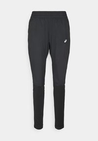 Zwarte sportbroek met een elastische tailleband, ritszakken aan de zijkant en een contrasterend paneel aan de onderkant van het been. Bevat een klein logo aan de voorkant.