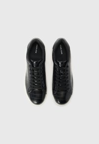 Black synthetic sneakers with a textured, crocodile pattern. Round toe, lace-up design, and a contrasting white sole. Brand name visible inside.