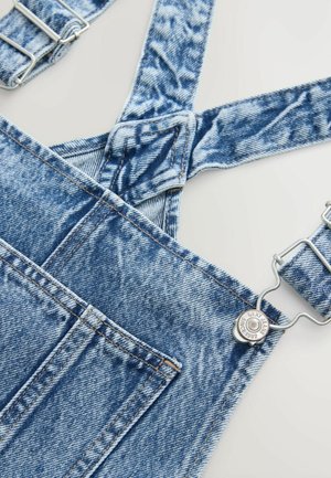 Denim overalls with adjustable straps, light blue wash, and silver hardware. Features pocket and distressed detailing on fabric.